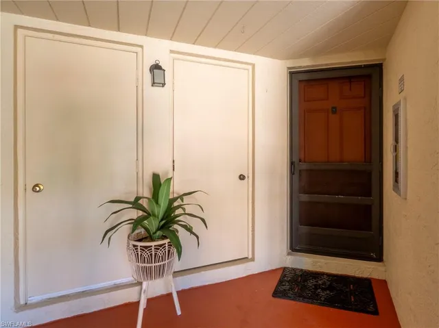 a glass room with a potted plant