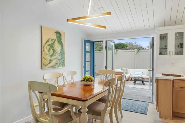 a dining room with furniture and window