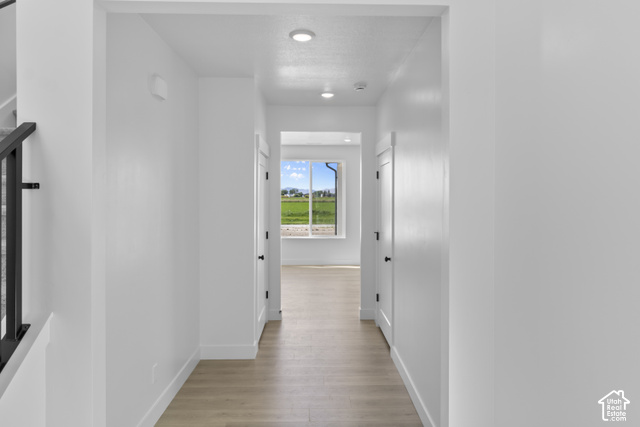 537 South 1150 West Logan, UT 84321 - Photo 4 of 33 Recessed lighting illuminating a hallway with wood-finish flooring