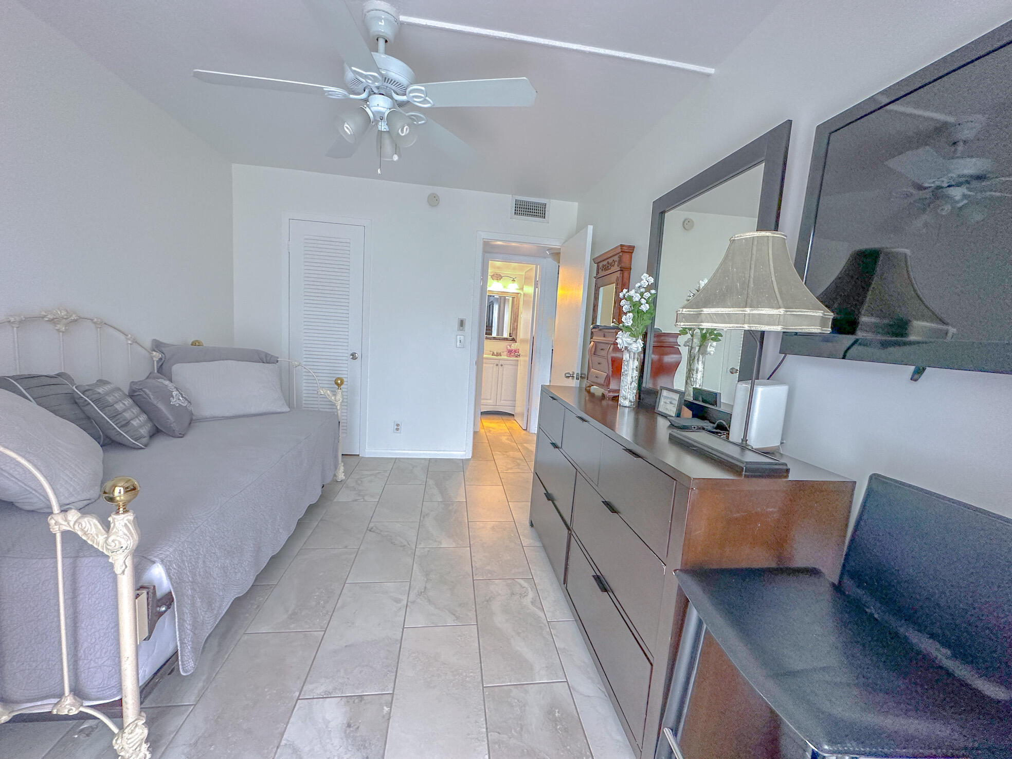 127 Mansfield D Boca Raton, FL 33434 - Photo 15 of 27 a living room with furniture and a chandelier