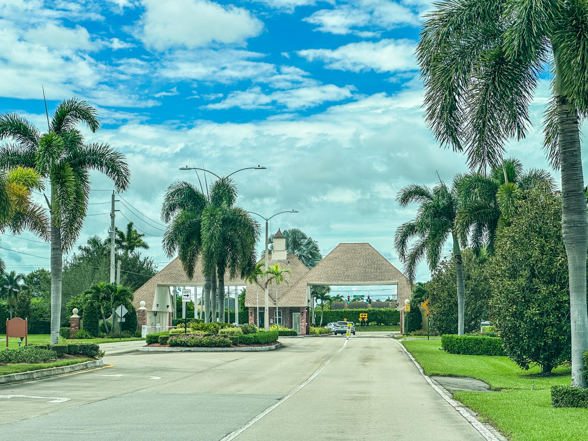 127 Mansfield D Boca Raton, FL 33434 - Photo 20 of 27 a front view of house with yard and green space
