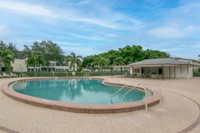 a view of a swimming pool with a patio