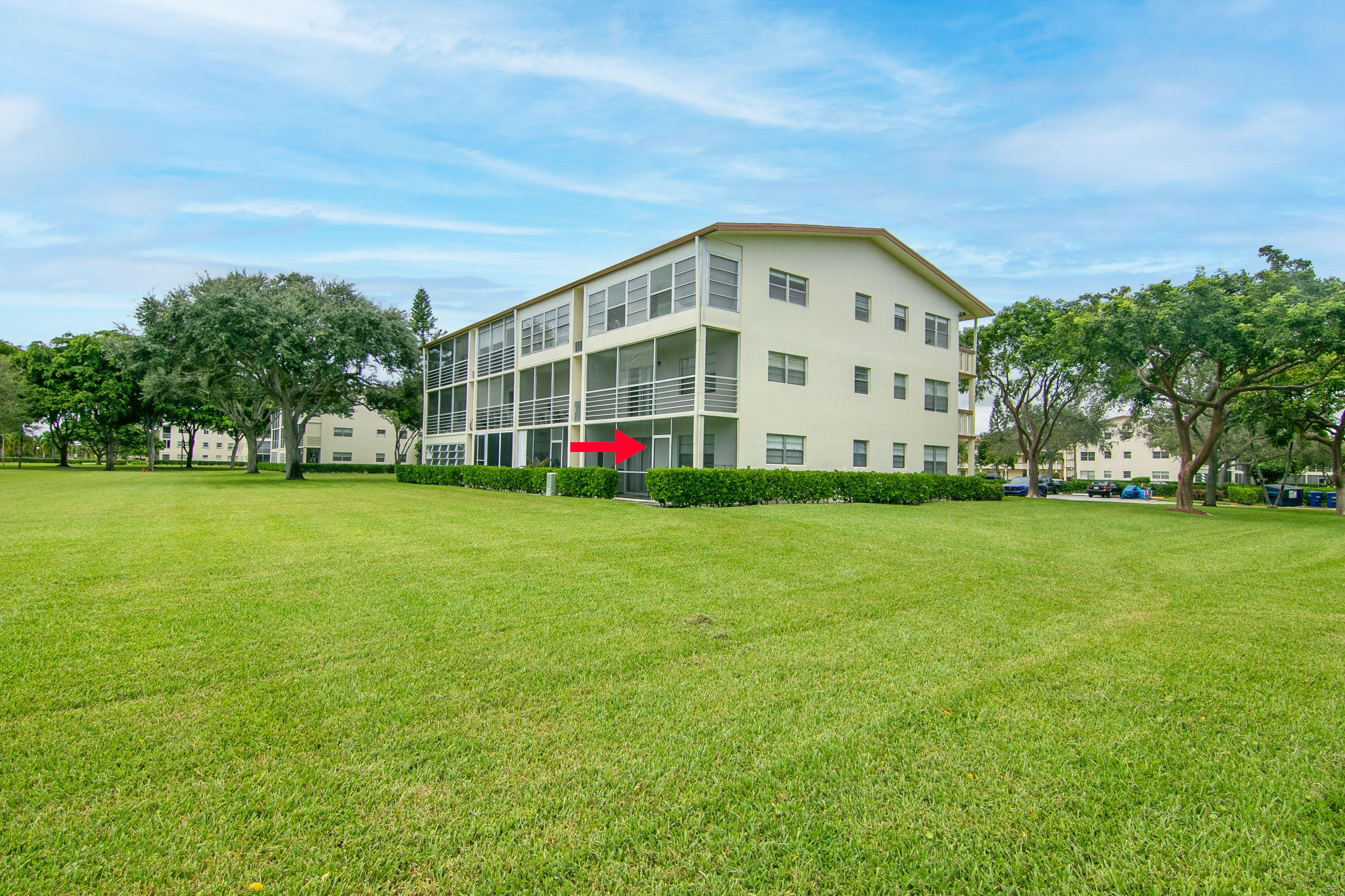127 Mansfield D Boca Raton, FL 33434 - Photo 26 of 27 a view of a house with a big yard