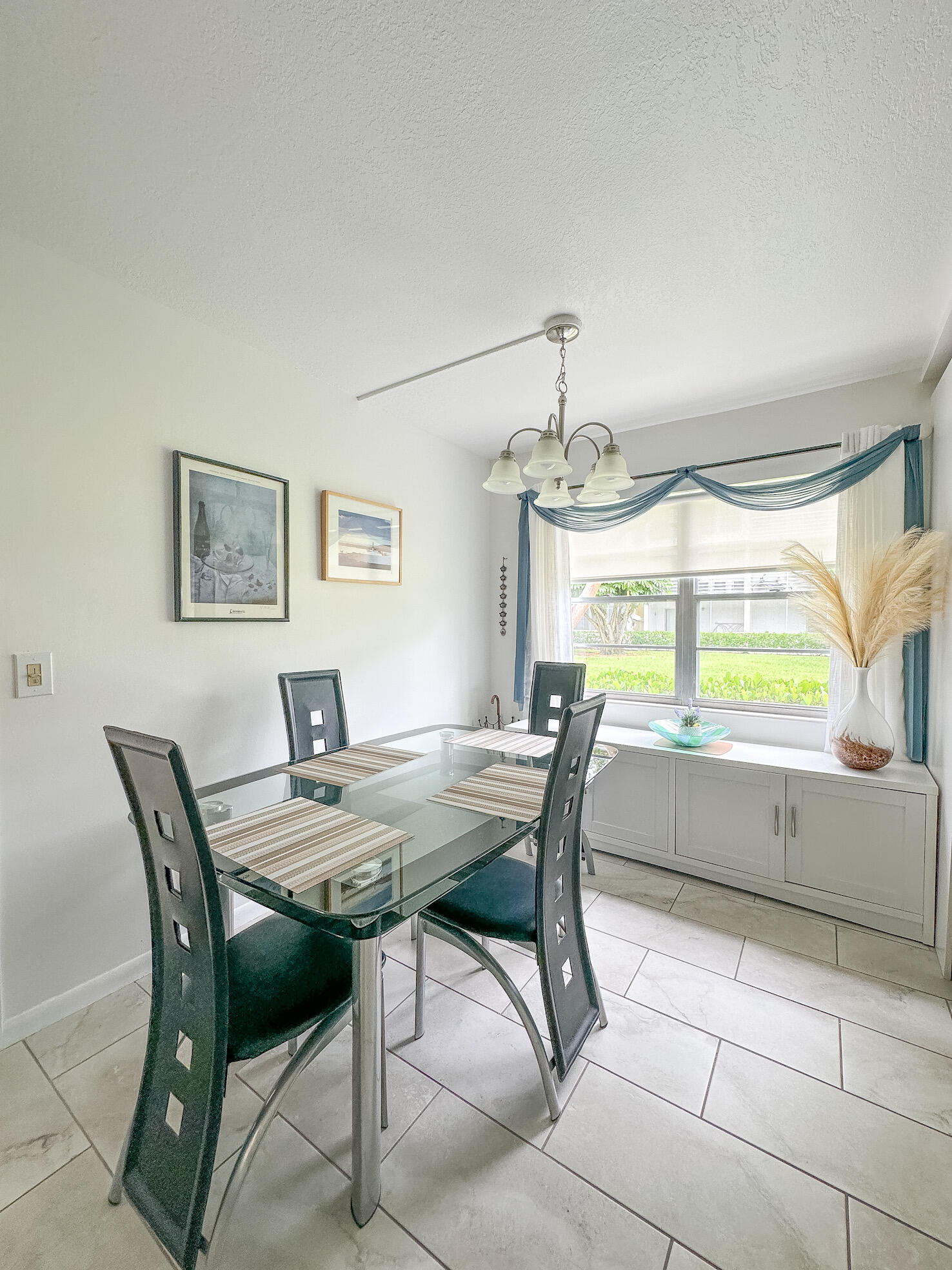 127 Mansfield D Boca Raton, FL 33434 - Photo 5 of 27 a view of a dining room with furniture and window