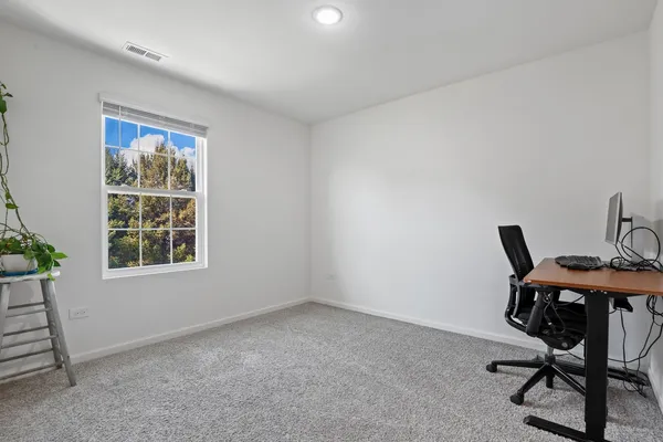 a workspace with furniture and window