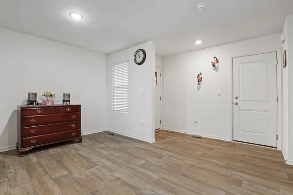 a view of room with wooden floor