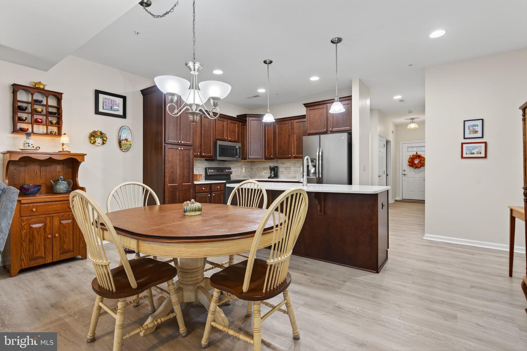 1334 Woodcrest Court Mount Joy, PA 17552 - Photo 13 of 37 a view of a dining room with furniture and wooden floor