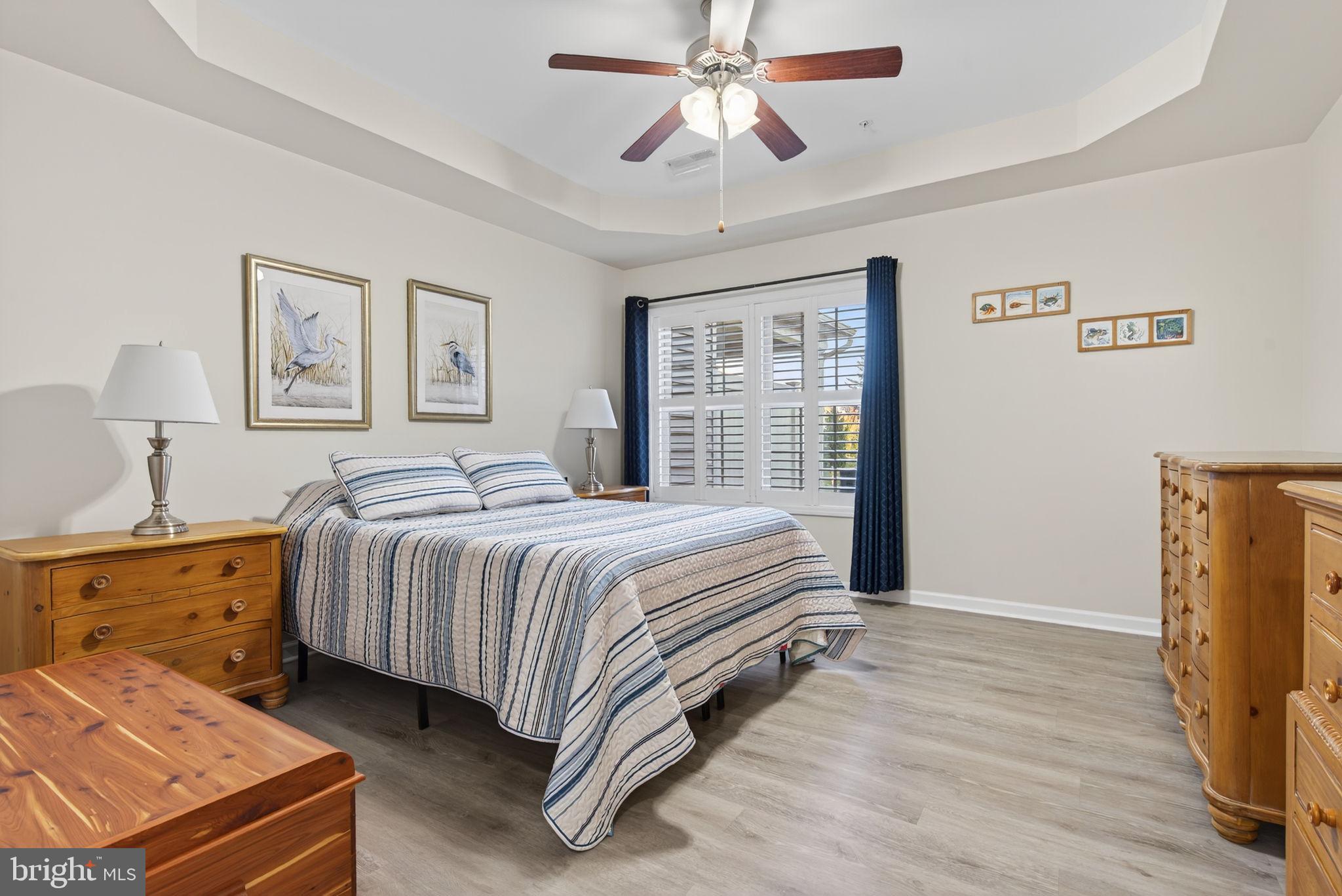 1334 Woodcrest Court Mount Joy, PA 17552 - Photo 16 of 37 a spacious bedroom with a bed and a chandelier