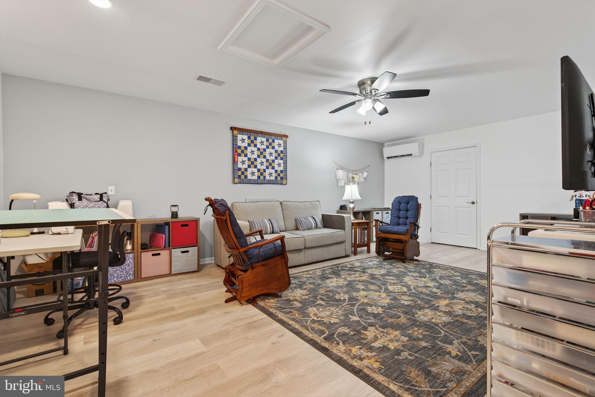 1334 Woodcrest Court Mount Joy, PA 17552 - Photo 27 of 37 a living room with furniture and a flat screen tv