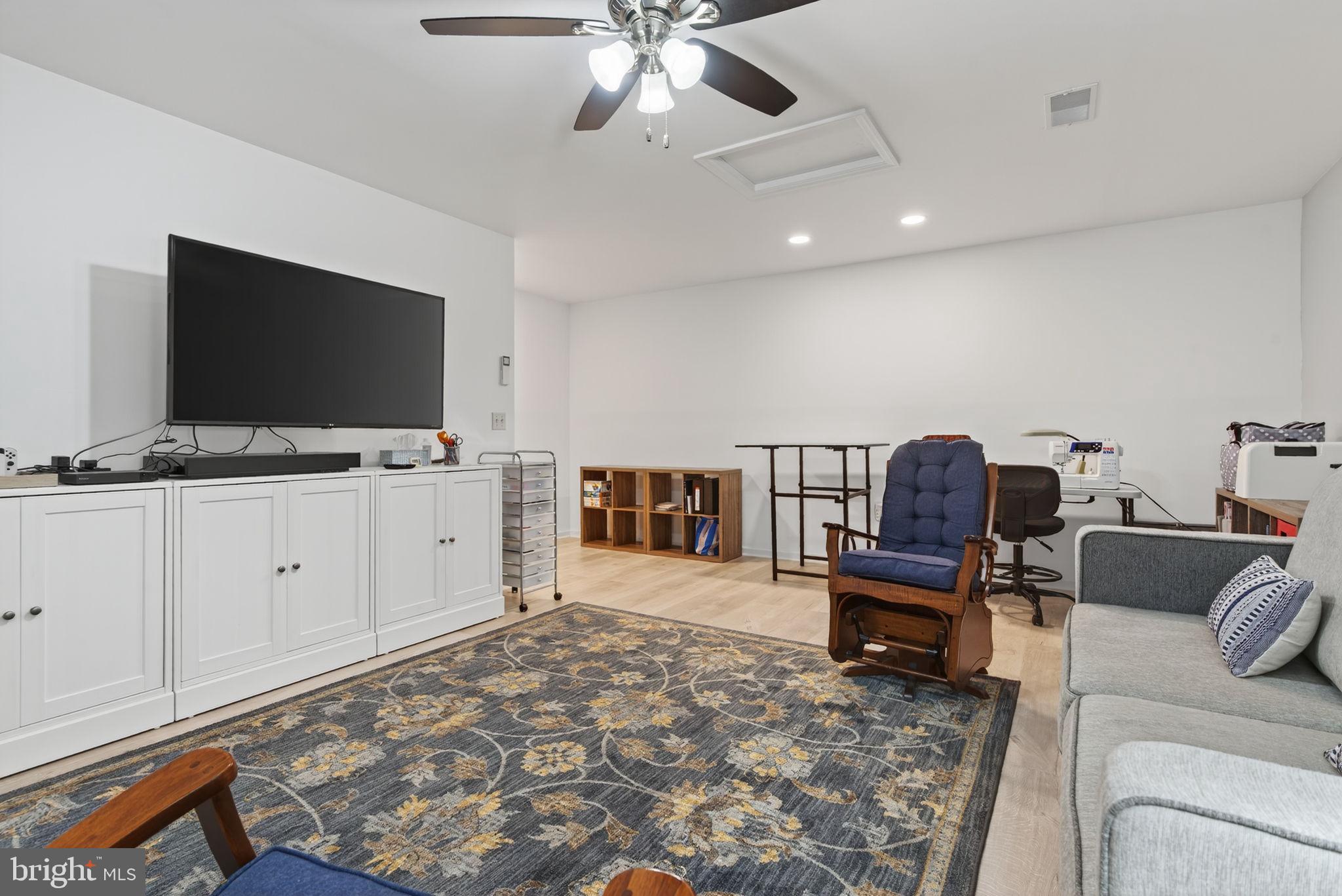 1334 Woodcrest Court Mount Joy, PA 17552 - Photo 28 of 37 a living room with furniture and a flat screen tv