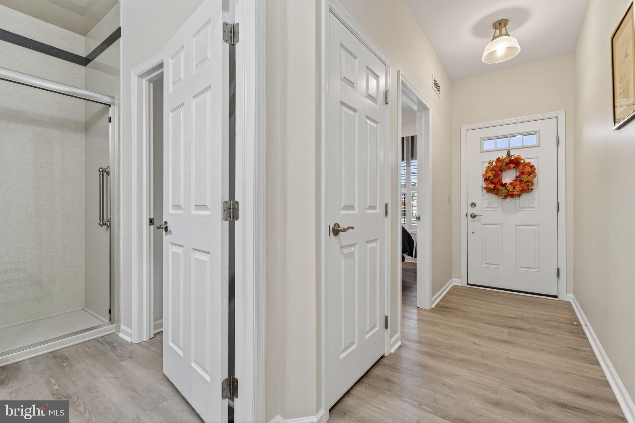 1334 Woodcrest Court Mount Joy, PA 17552 - Photo 3 of 37 a view of a hallway with wooden floor and closet