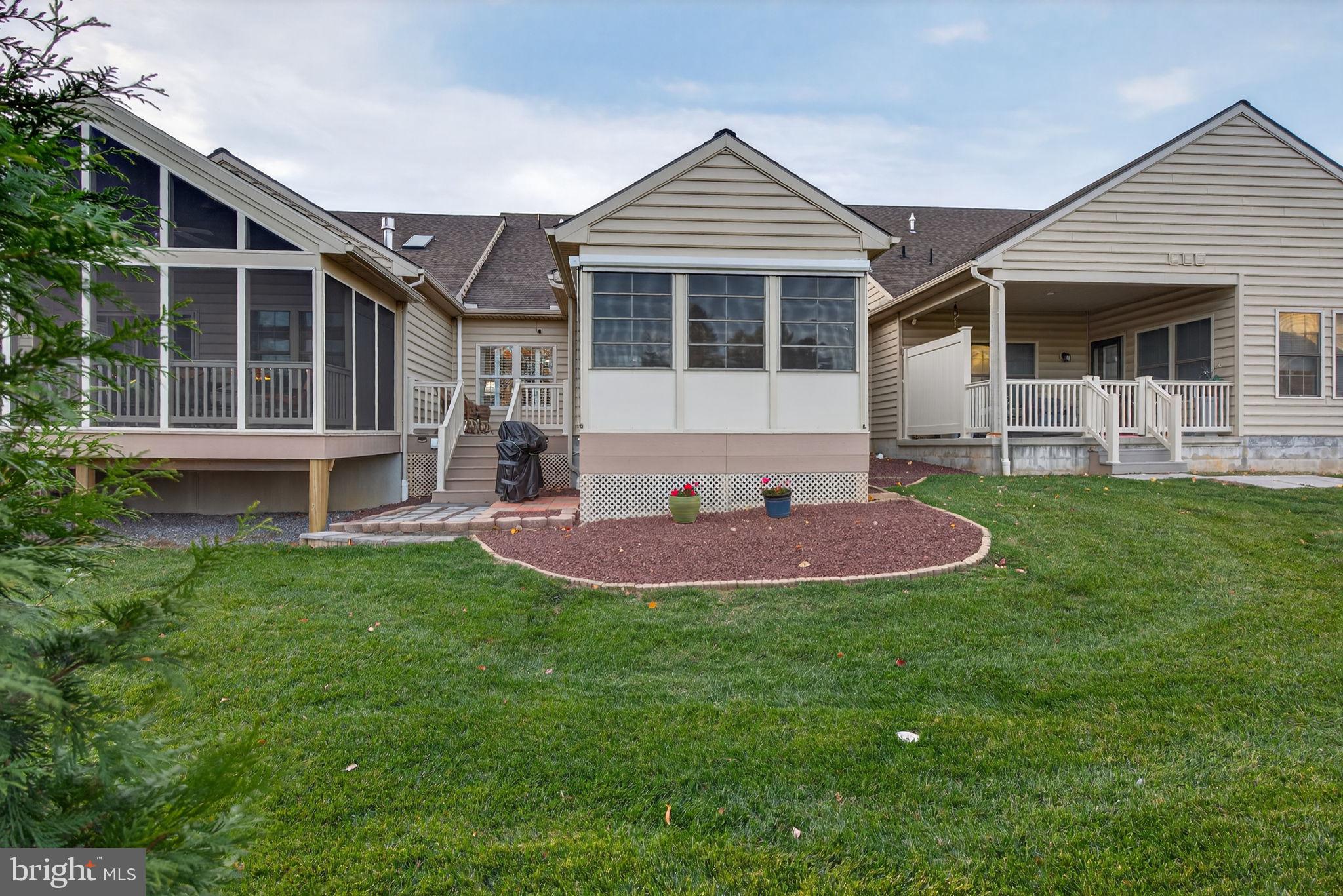1334 Woodcrest Court Mount Joy, PA 17552 - Photo 31 of 37 a front view of a house with a yard table and chairs
