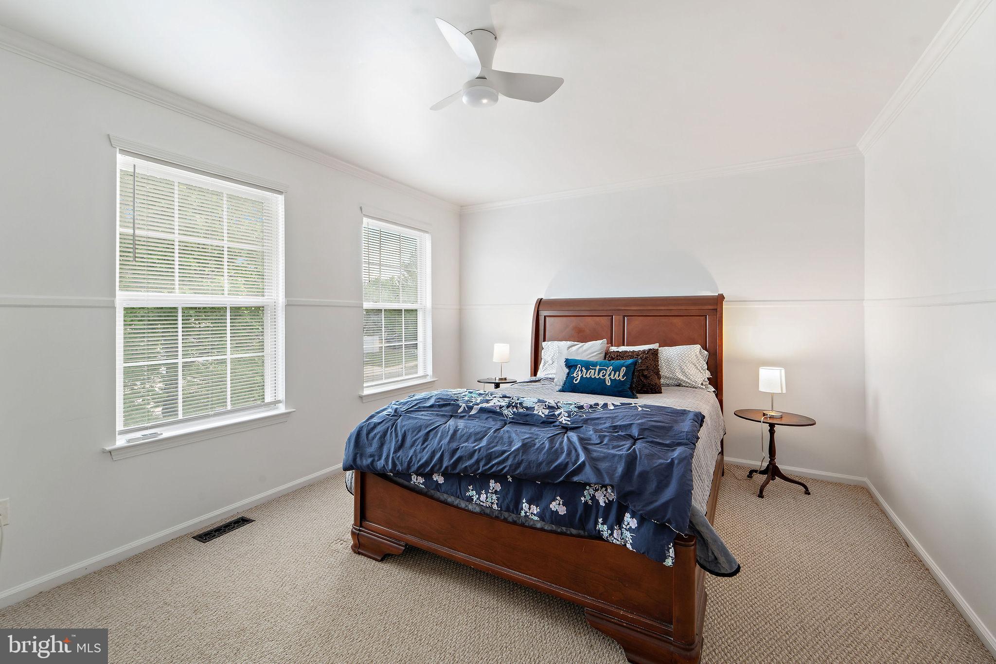 96 High Meadows Drive Sicklerville, NJ 08081 - Photo 13 of 20 a bed sitting in a bedroom next to a window