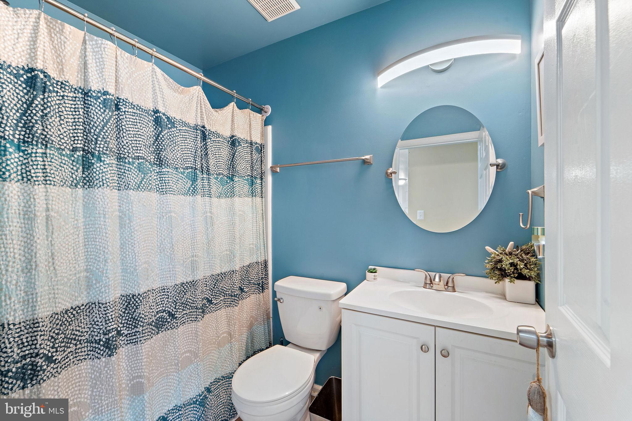 96 High Meadows Drive Sicklerville, NJ 08081 - Photo 14 of 20 a bathroom with a toilet a sink and a mirror