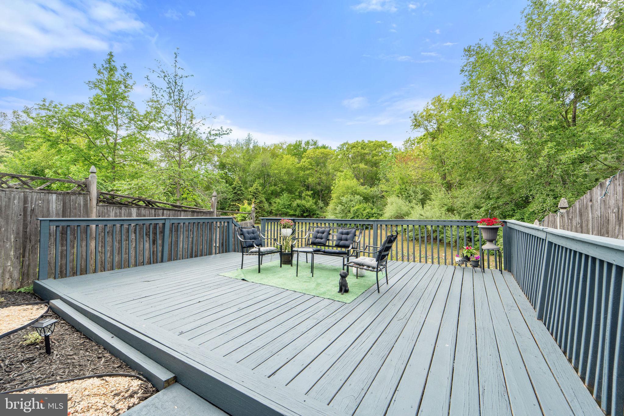 96 High Meadows Drive Sicklerville, NJ 08081 - Photo 18 of 20 a balcony with wooden floor table and chairs