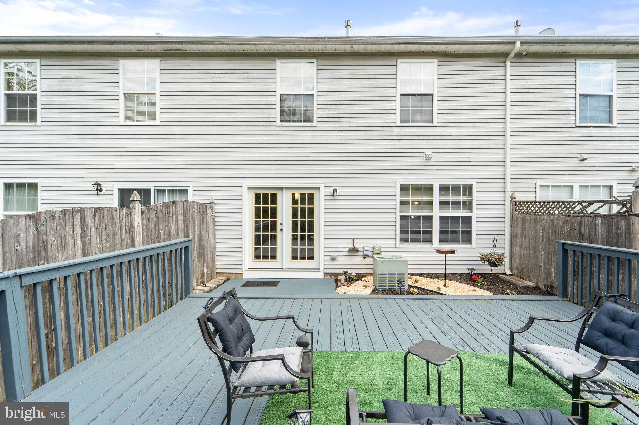 96 High Meadows Drive Sicklerville, NJ 08081 - Photo 19 of 20 a view of a patio with a table and chairs