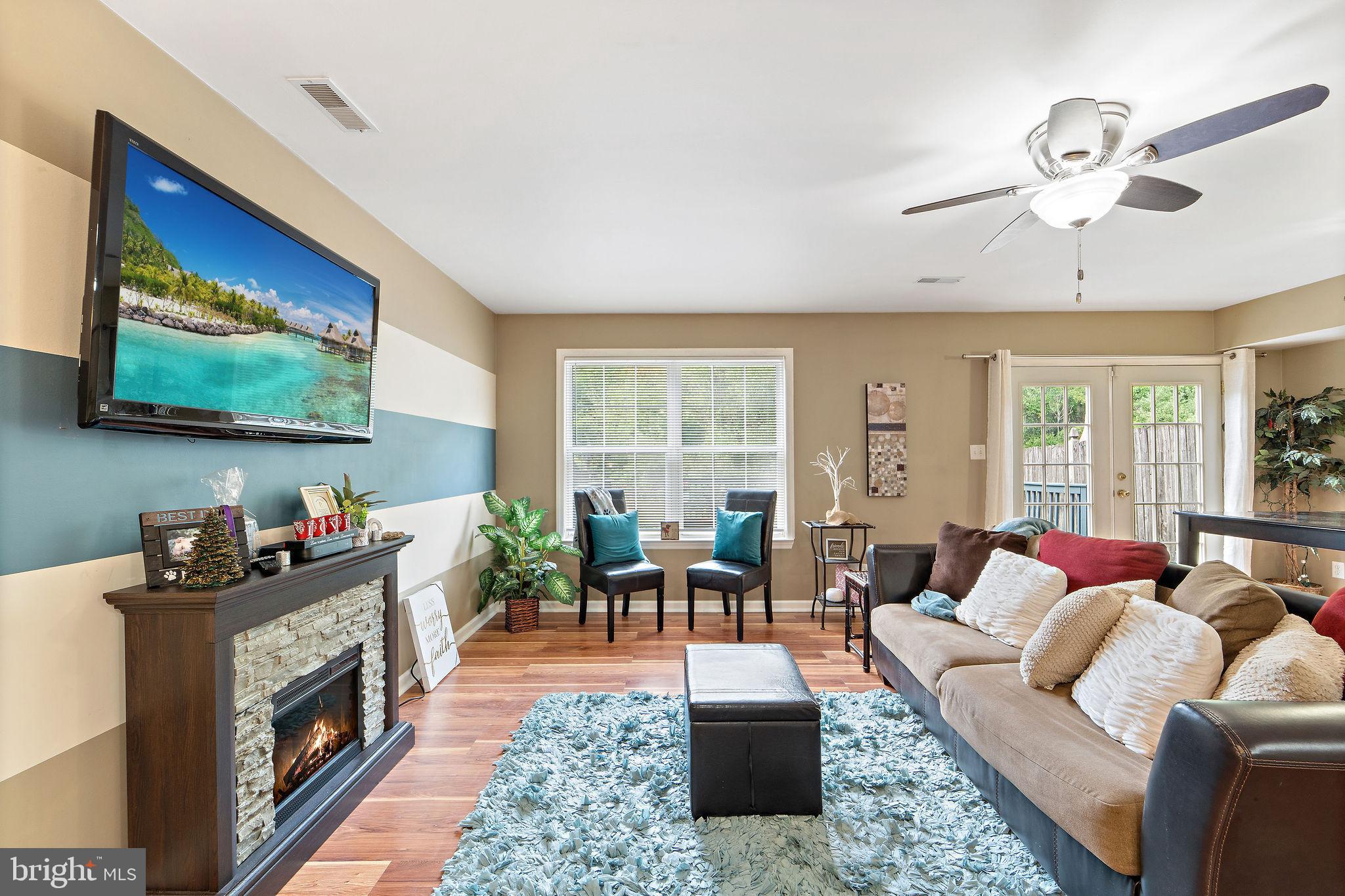 96 High Meadows Drive Sicklerville, NJ 08081 - Photo 6 of 20 a living room with furniture and a fireplace