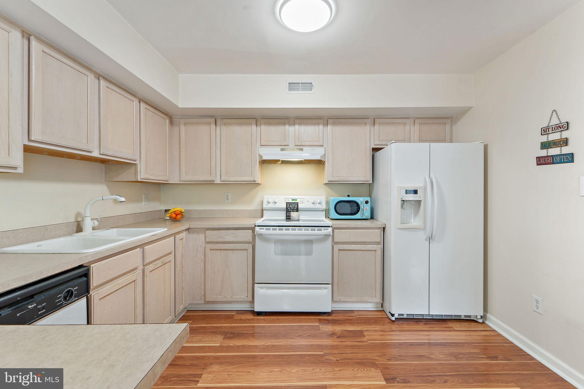 96 High Meadows Drive Sicklerville, NJ 08081 - Photo 8 of 20 a kitchen with a white stove top oven and refrigerator