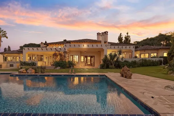 a view of a yard with swimming pool
