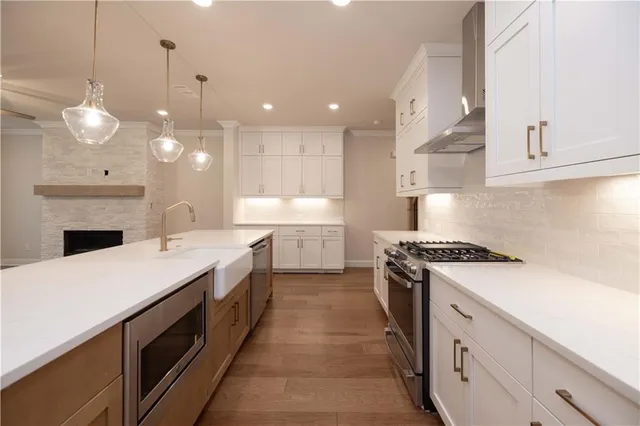 a kitchen with a stove and a sink