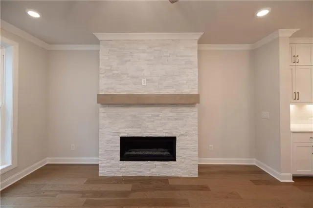 a large room with a lot of counter space and a ceiling fan