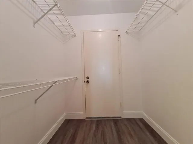 a view of a room with racks on the wall