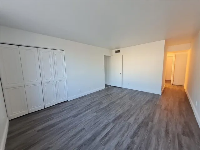 a view of a livingroom with wooden floor
