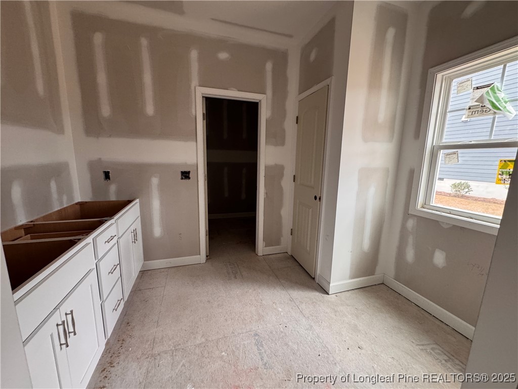 653 Watauga Lane Aberdeen, NC 28315 - Photo 20 of 38 a kitchen with granite countertop a refrigerator and a sink