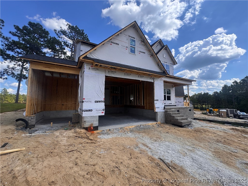 653 Watauga Lane Aberdeen, NC 28315 - Photo 4 of 38 a front view of a house with a yard and garage