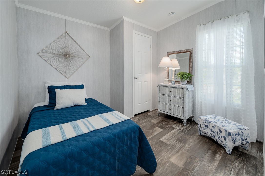 132 Cape Sable Drive Naples, FL 34104 - Photo 13 of 20 a bedroom with a bed and a window