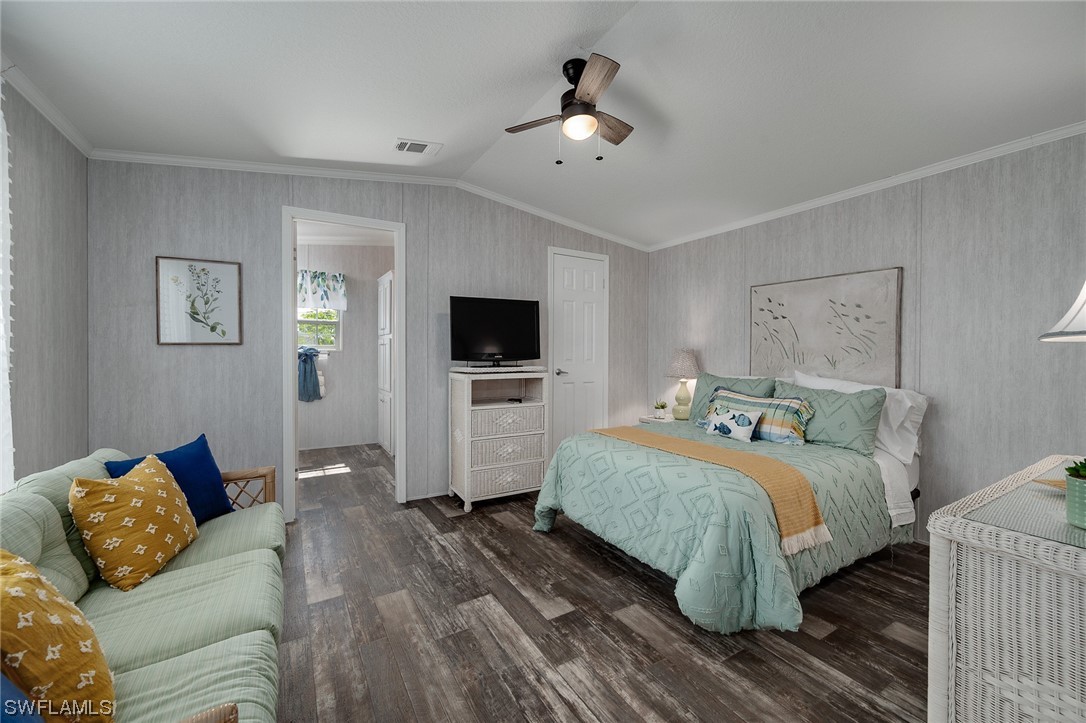 132 Cape Sable Drive Naples, FL 34104 - Photo 15 of 20 a bedroom with a bed and a flat screen tv