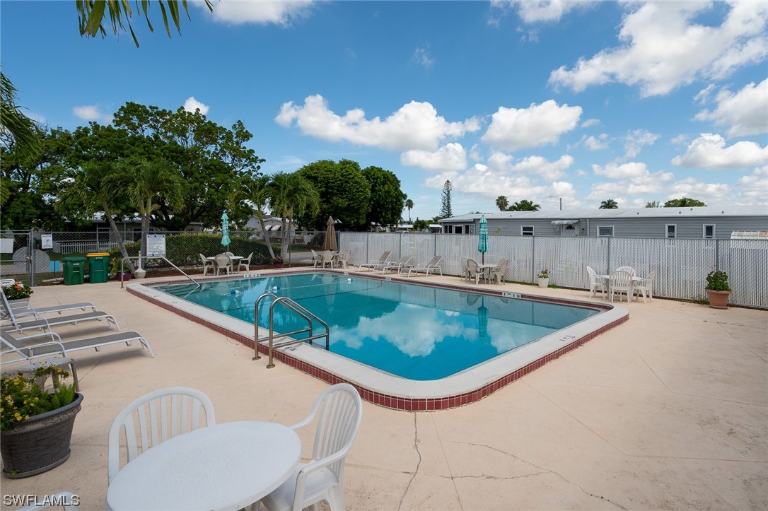 132 Cape Sable Drive Naples, FL 34104 - Photo 20 of 20 a view of a swimming pool with a terrace