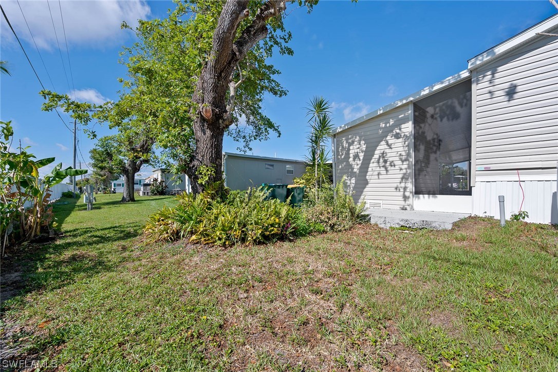 132 Cape Sable Drive Naples, FL 34104 - Photo 3 of 20 a view of a house with a yard