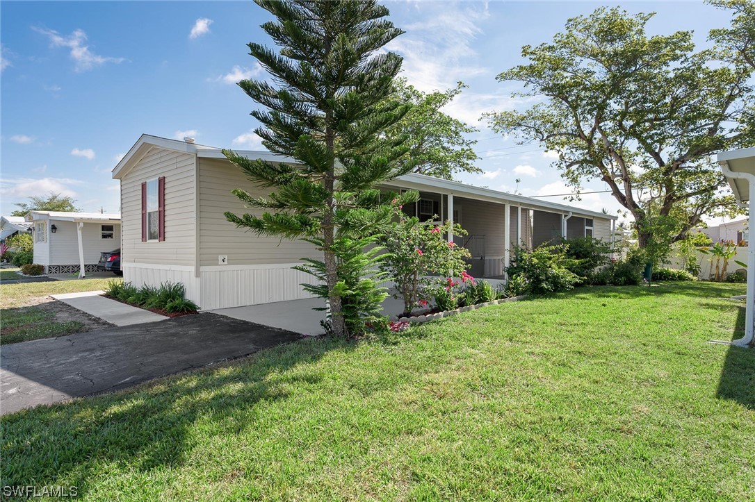 132 Cape Sable Drive Naples, FL 34104 - Photo 4 of 20 a view of backyard of house with green space