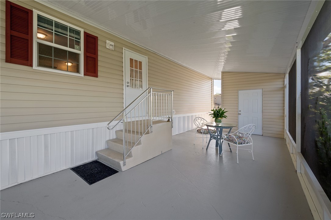 132 Cape Sable Drive Naples, FL 34104 - Photo 6 of 20 a view of entryway and hall with wooden floor