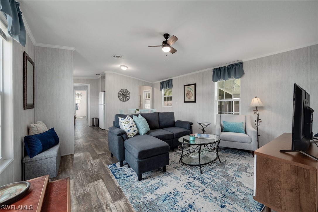 132 Cape Sable Drive Naples, FL 34104 - Photo 9 of 20 a living room with furniture and a flat screen tv