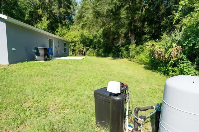 a view of a backyard with seating area
