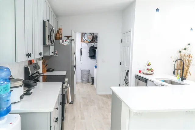 a room with a sink and a mirror