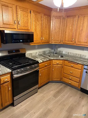a white refrigerator freezer sitting in a kitchen
