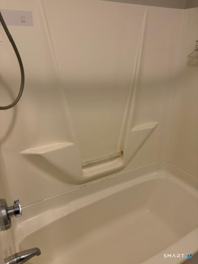 65 Ingraham Street, Unit 2 Bristol, CT 06010 - Photo 7 of 11 a bathroom with a bathtub