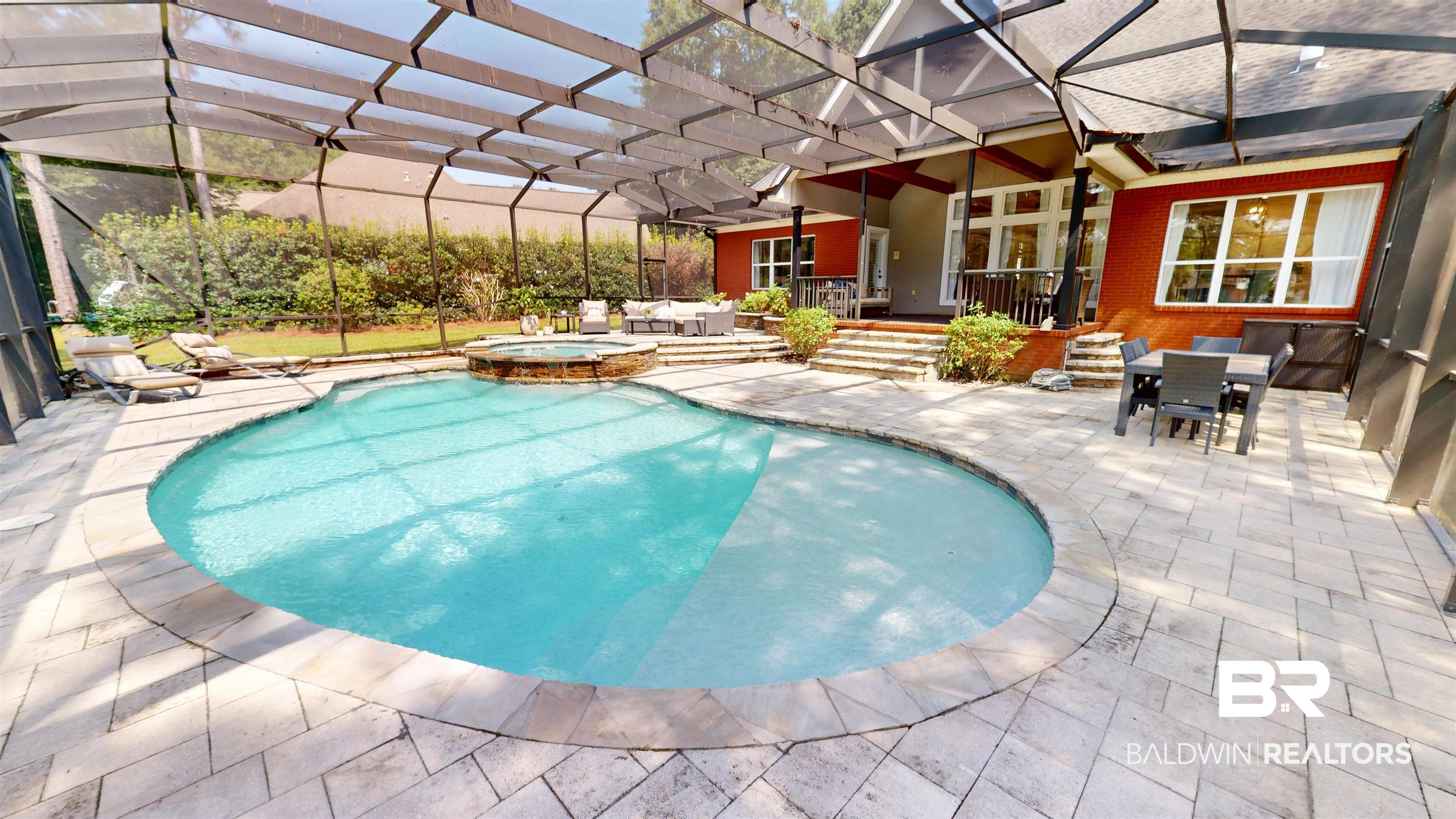 8775 Dawes Lake Road North Mobile, AL 36619 - Photo 43 of 59 View of pool featuring a patio, outdoor dining area, and a pool with connected hot tub