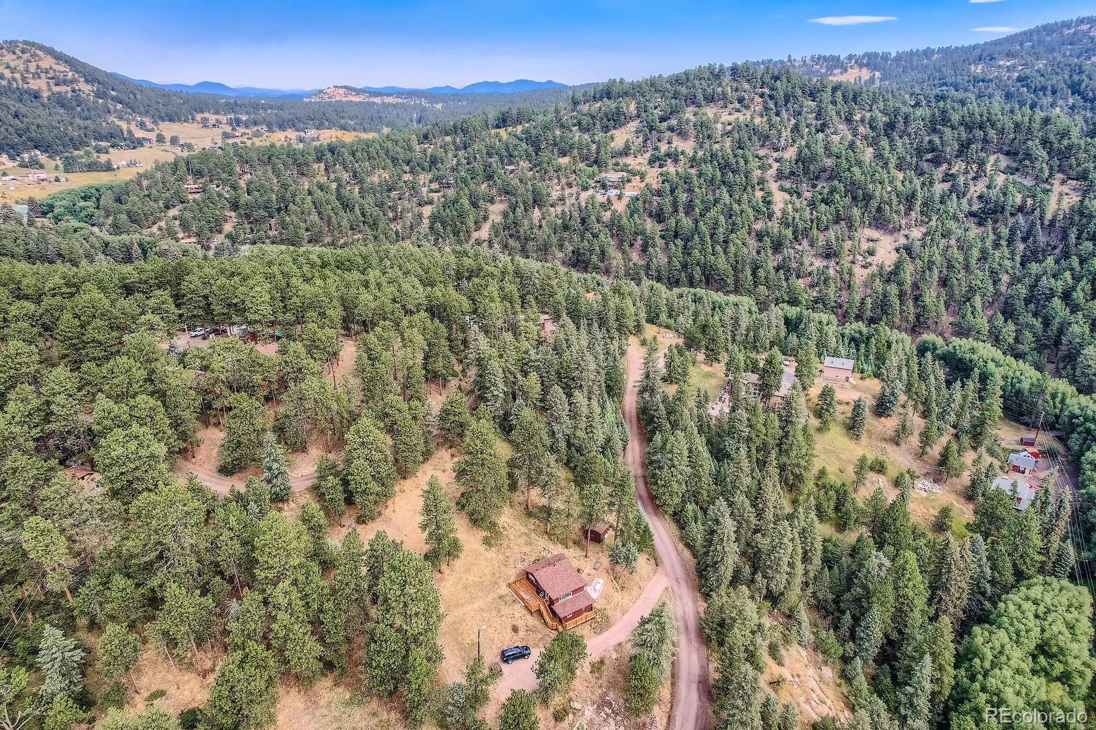5296 Cherokee Road Indian Hills, CO 80454 - Photo 14 of 26 a view of a city with mountains in the background