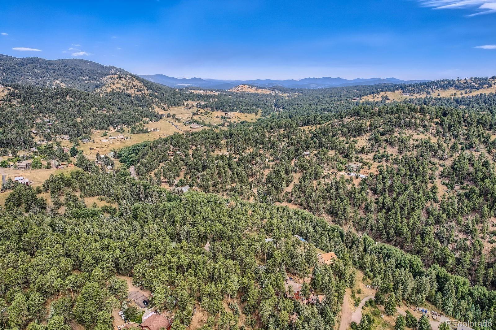 5296 Cherokee Road Indian Hills, CO 80454 - Photo 20 of 26 a view of a city with mountains in the background