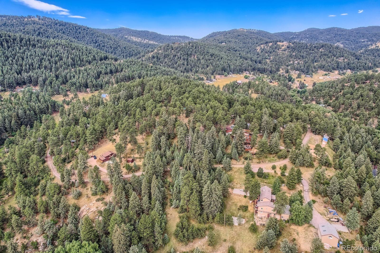 5296 Cherokee Road Indian Hills, CO 80454 - Photo 23 of 26 a view of a mountains in the background