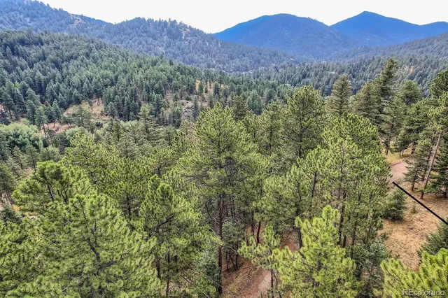 a view of mountains and valleys