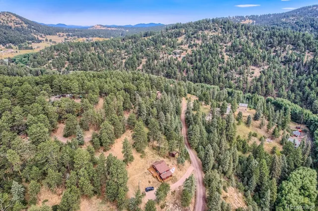 a view of a city with mountains in the background