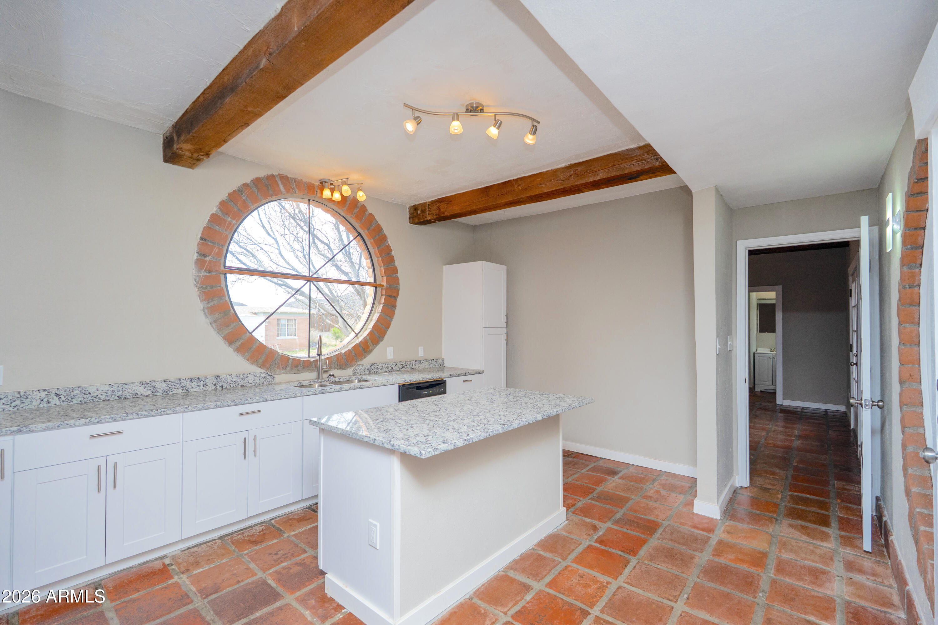 4 Cochise Lane Bisbee, AZ 85603 - Photo 14 of 72 a kitchen with granite countertop a sink and a stove