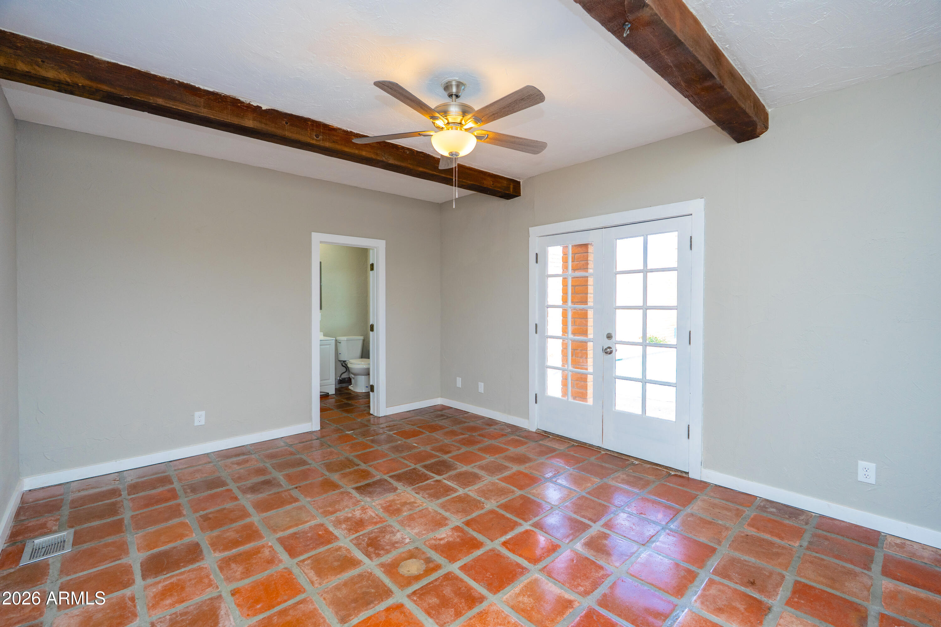 4 Cochise Lane Bisbee, AZ 85603 - Photo 21 of 72 a view of an empty room with window and chandelier fan