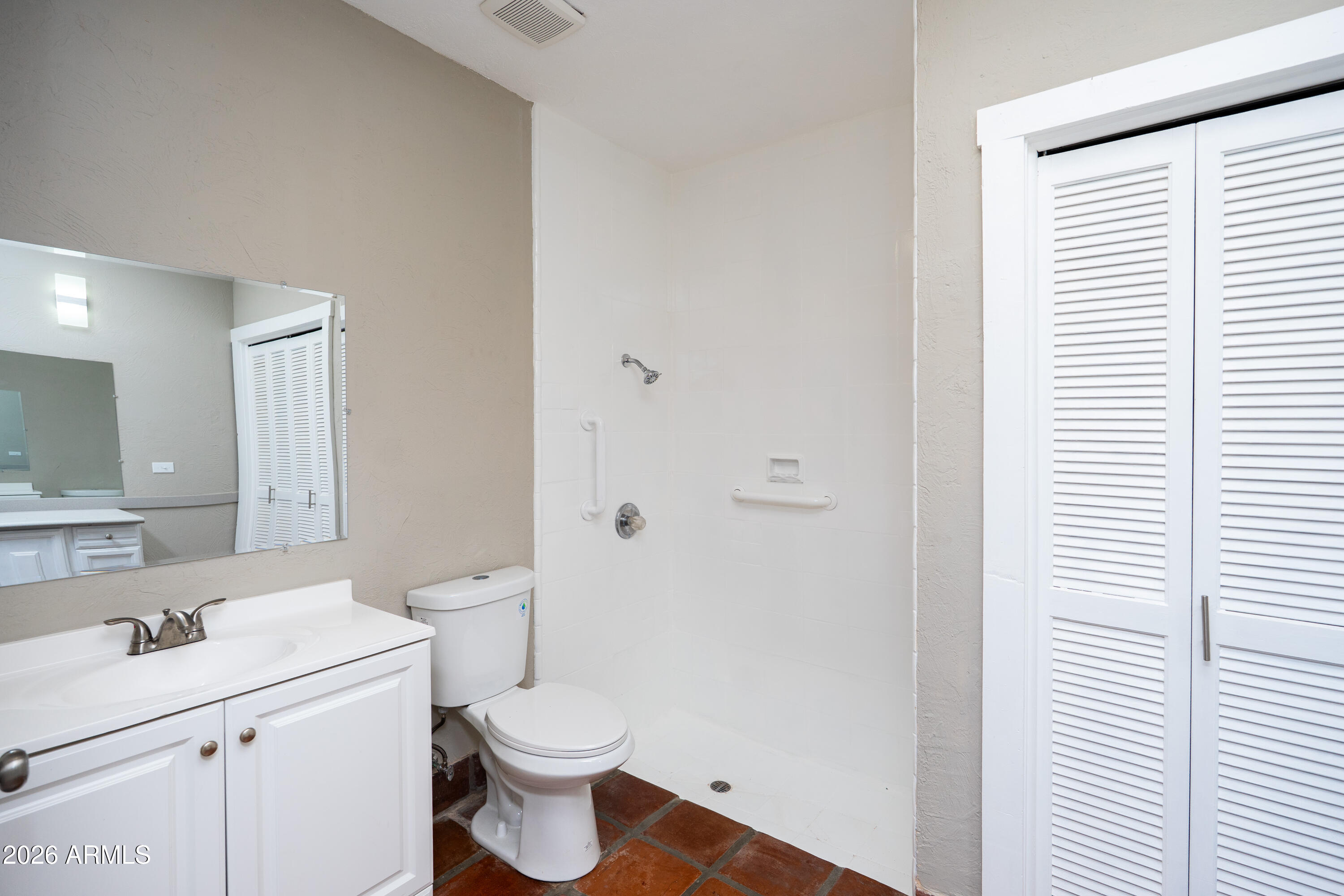 4 Cochise Lane Bisbee, AZ 85603 - Photo 30 of 72 a bathroom with a sink a toilet and a mirror