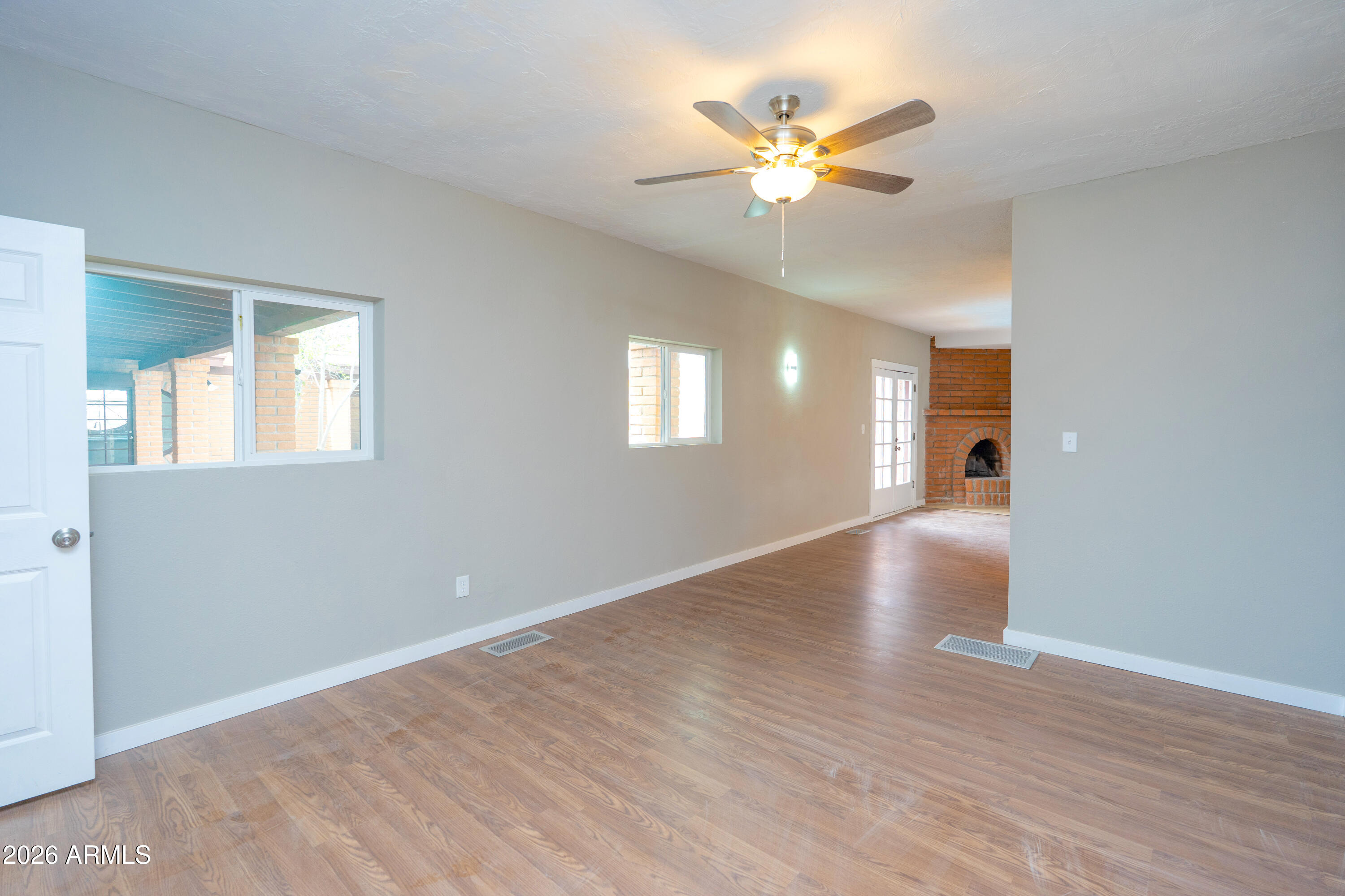 4 Cochise Lane Bisbee, AZ 85603 - Photo 34 of 72 a view of an empty room with chandelier fan and a chandelier fan